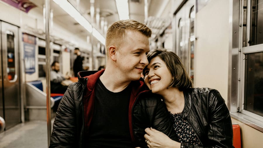 A woman and her companion enjoying time together in a city setting.