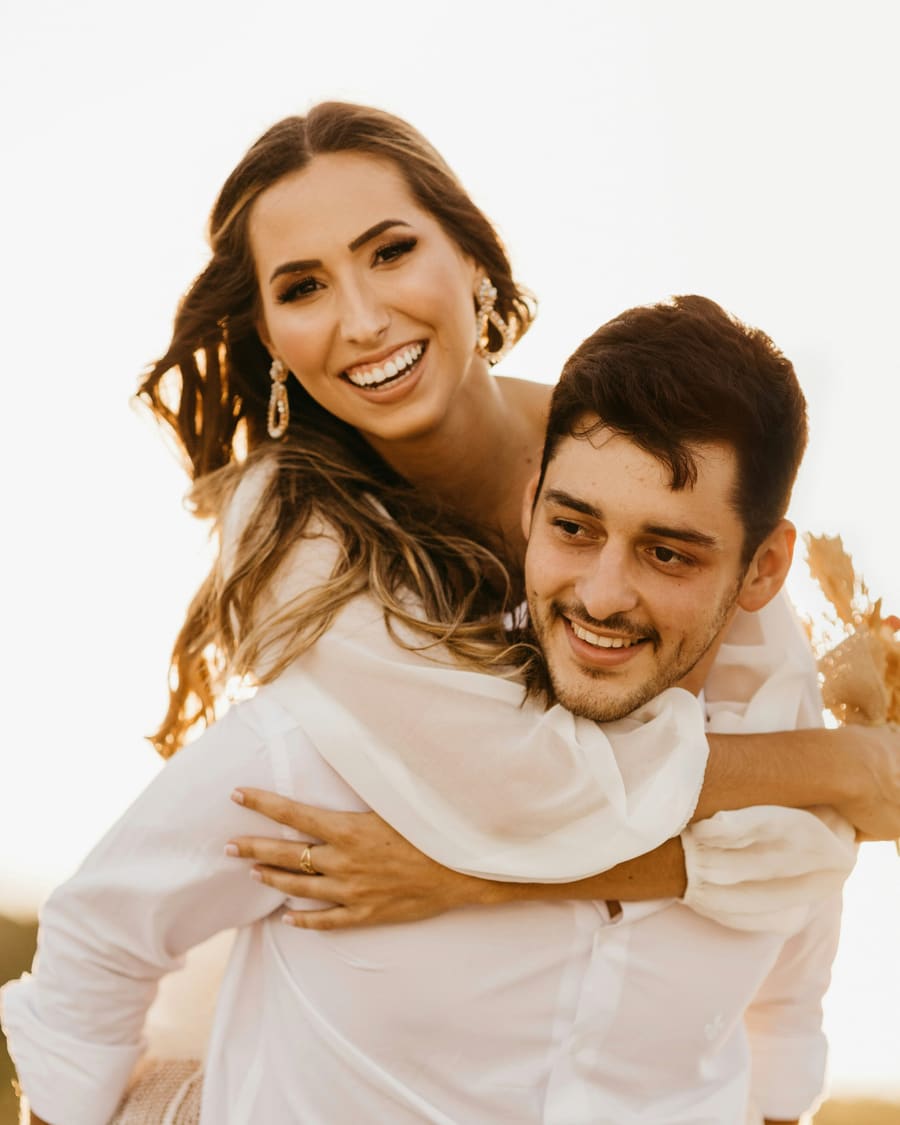 A woman with a polished companion in a formal occasion setting.