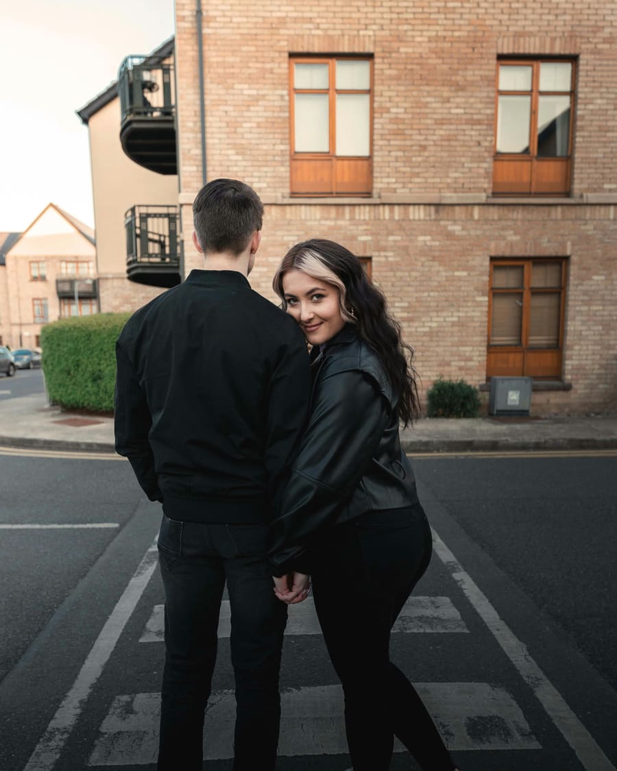 A woman and her companion enjoying time together in a city setting.