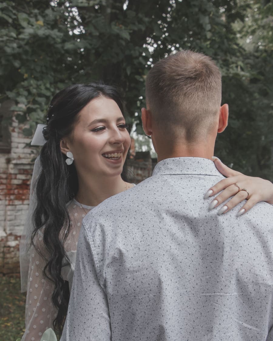 A woman with a polished companion in a formal occasion setting.