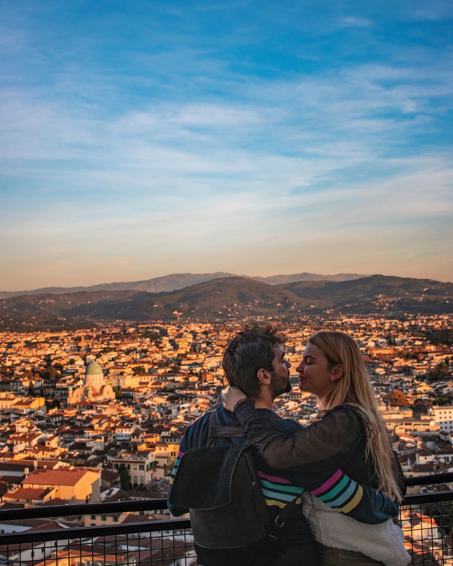A woman and her companion sharing an outdoor travel moment.